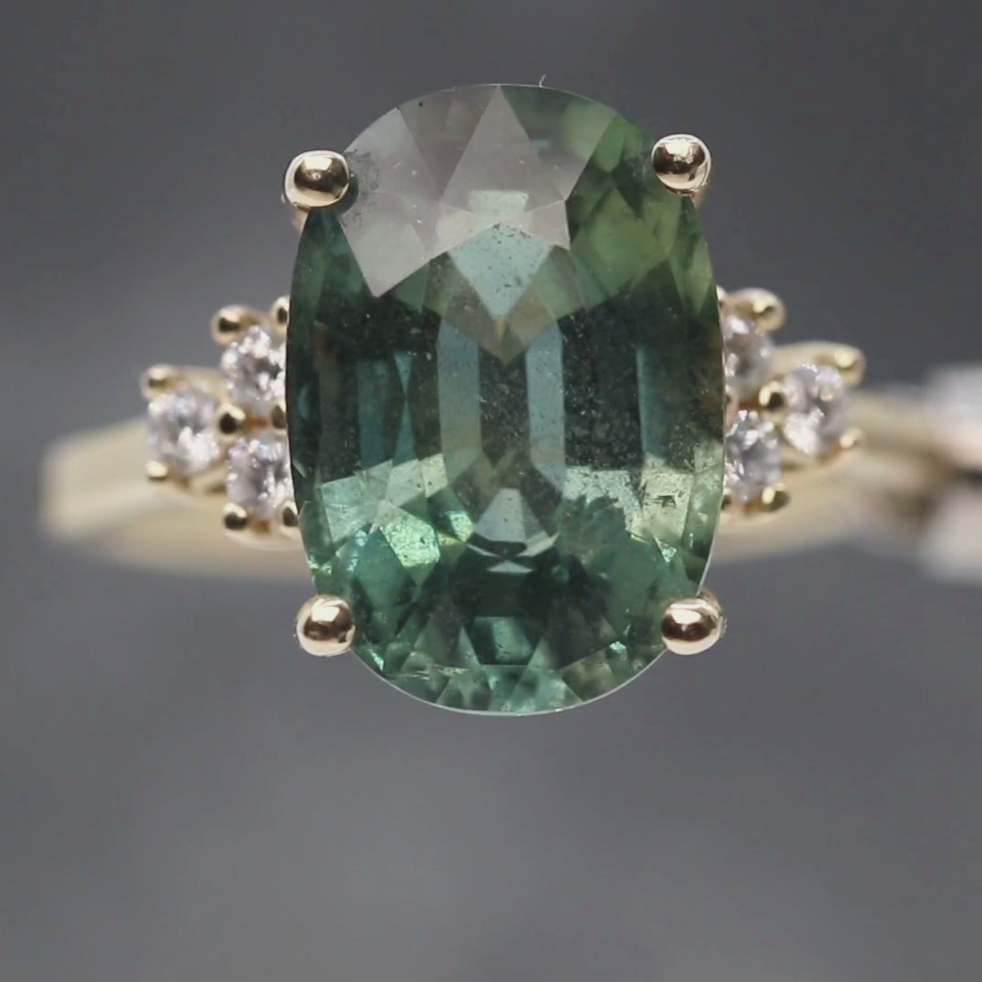 Veragene Ring with a 10.48 Carat Teal Oval Sapphire and White Accent Diamonds in 14k Yellow Gold - Ready to Size and Ship