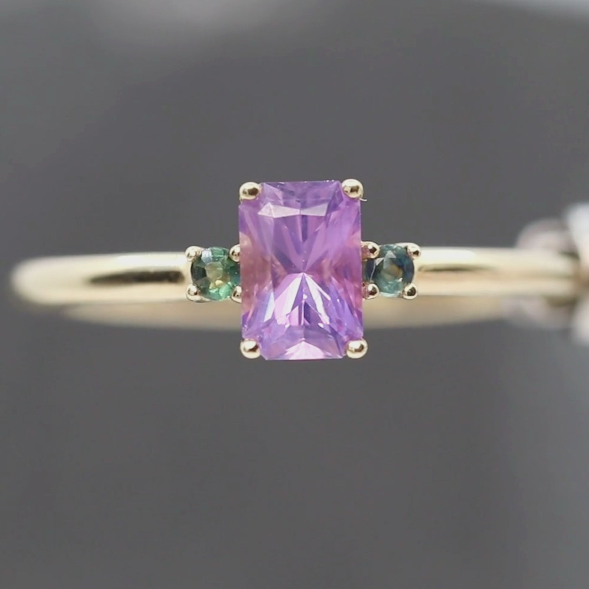 Terra Ring with a 0.81 Carat Radiant Cut Purple Sapphire and Teal Sapphire Accents in 14k Yellow Gold - Ready to Size and Ship