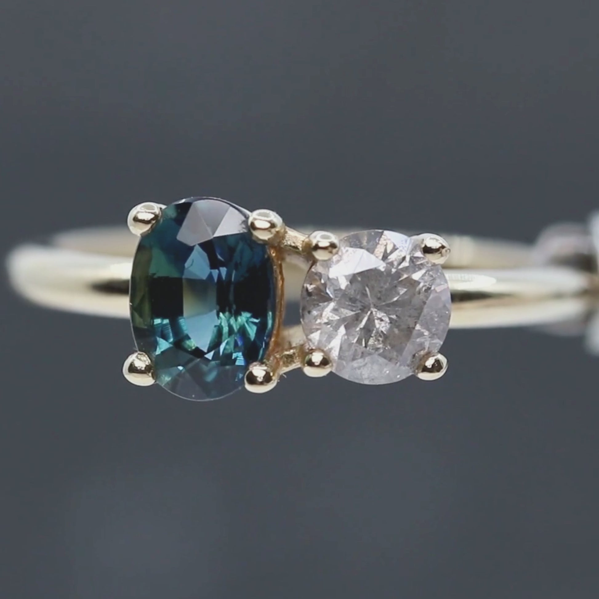Toi et Moi Ring with a 0.58 Carat Round Gray Salt and Pepper Diamond and a 1.11 Carat Teal Blue Oval Sapphire in 14k Yellow Gold - Ready to Size and Ship