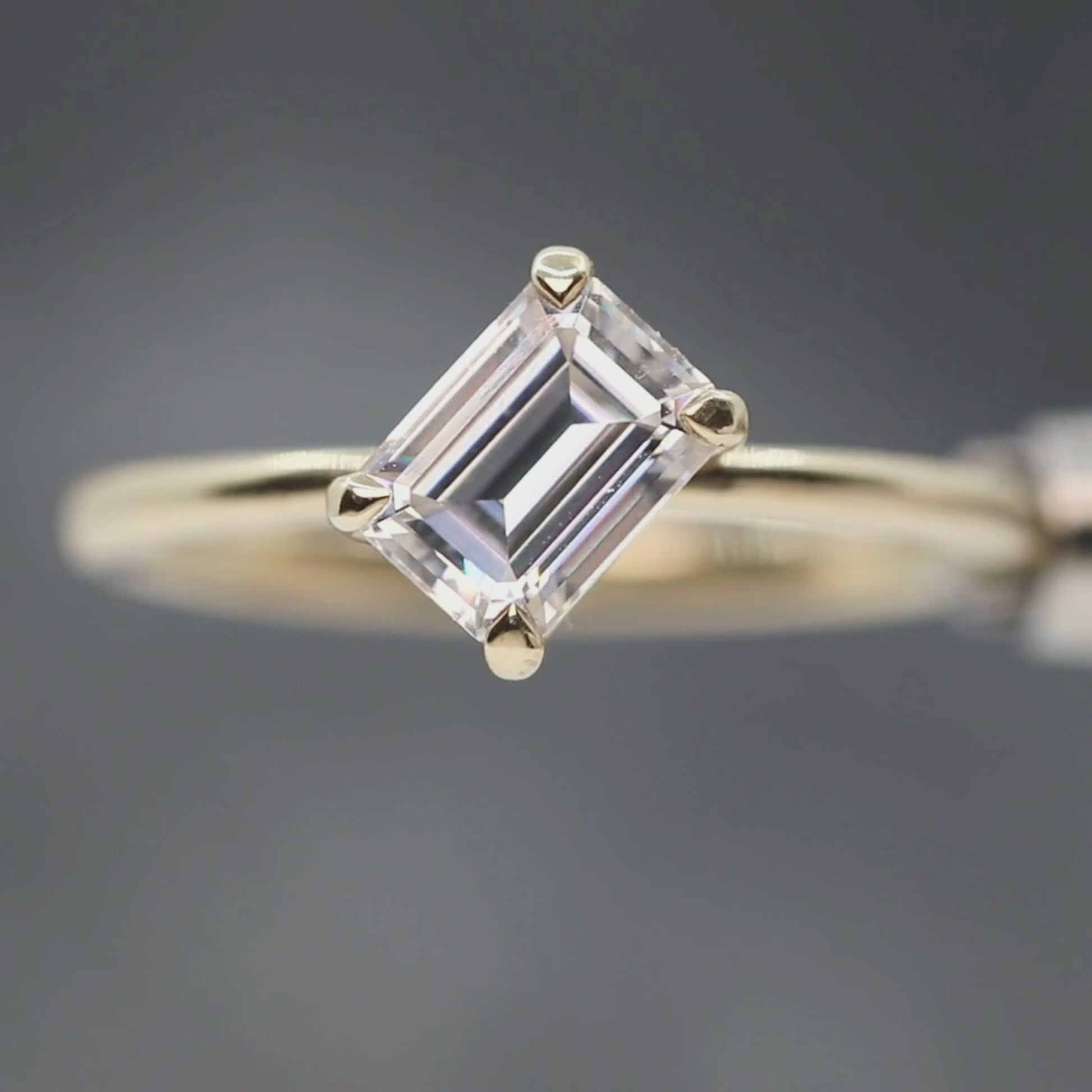 Natalia Ring with a 0.92 Carat White Emerald Cut Moissanite in 14k Yellow Gold - Ready to Size and Ship
