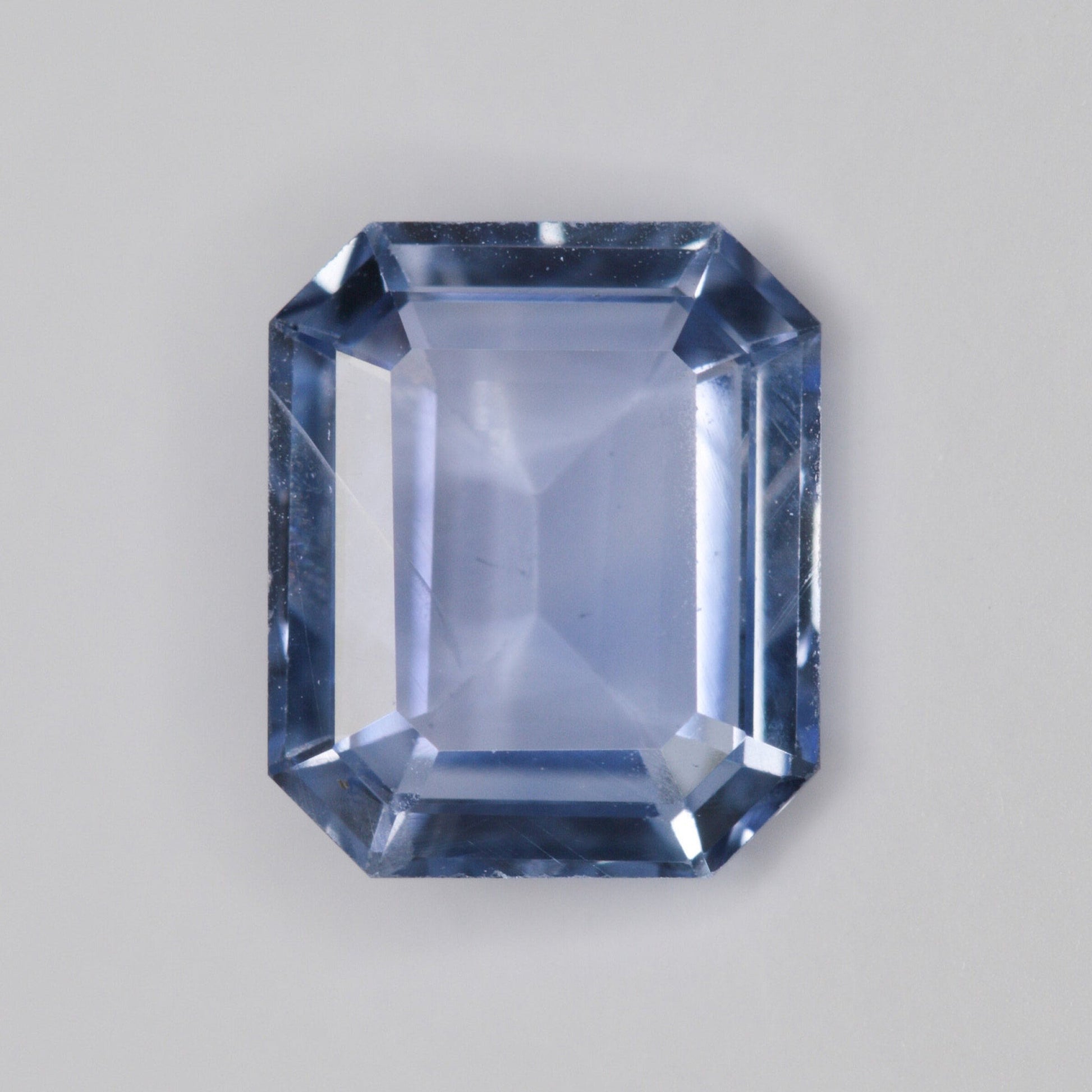 1.28 carat emerald cut cornflower blue sapphire - custom work - inventory code ECSB128 - Midwinter Co. Alternative Bridal Rings and Modern Fine Jewelry