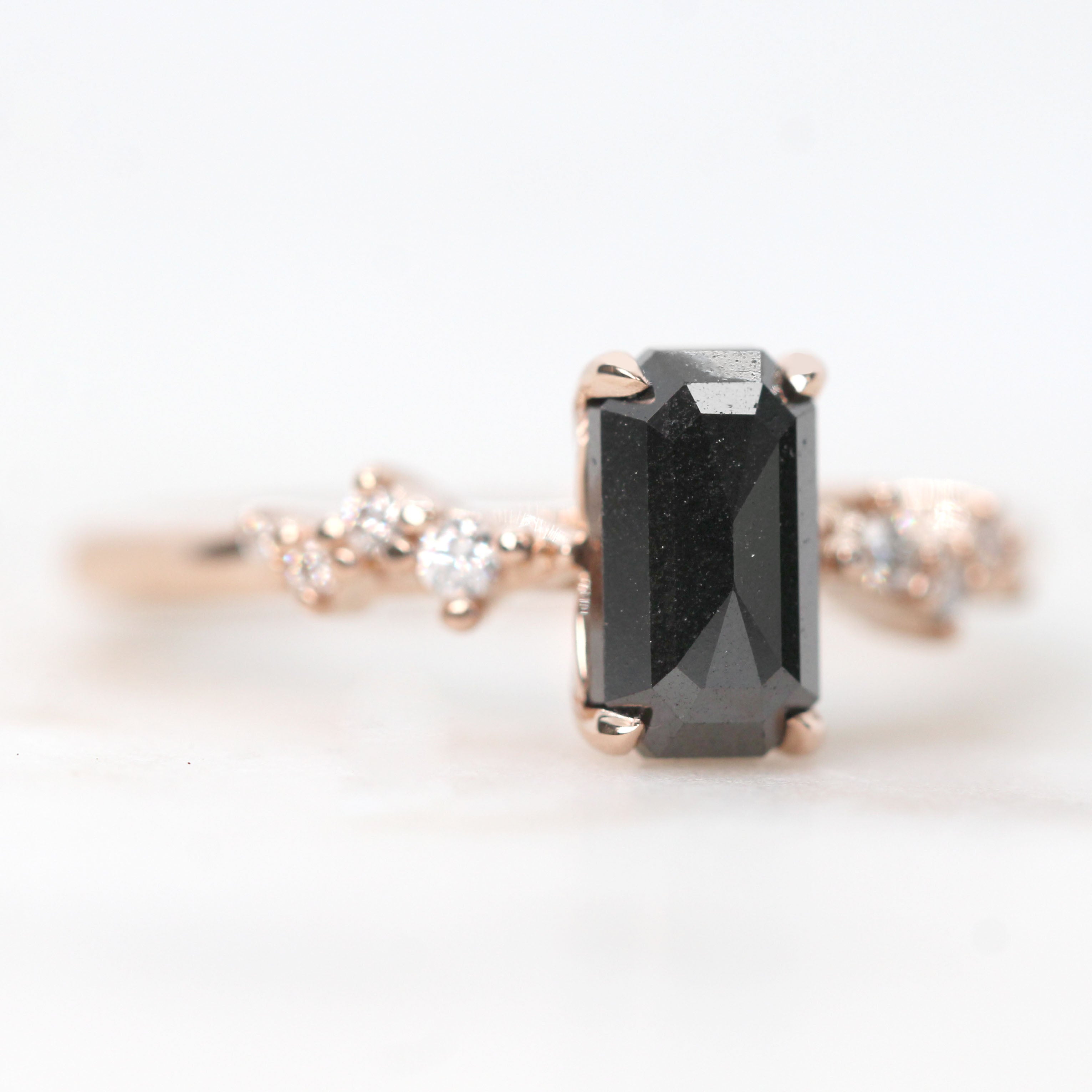 Zealan Ring with a 1.33 Carat Emerald Cut Black Celestial Diamond and White Accent Diamonds in 14k Rose Gold - Ready to Size and Ship - Midwinter Co. Alternative Bridal Rings and Modern Fine Jewelry