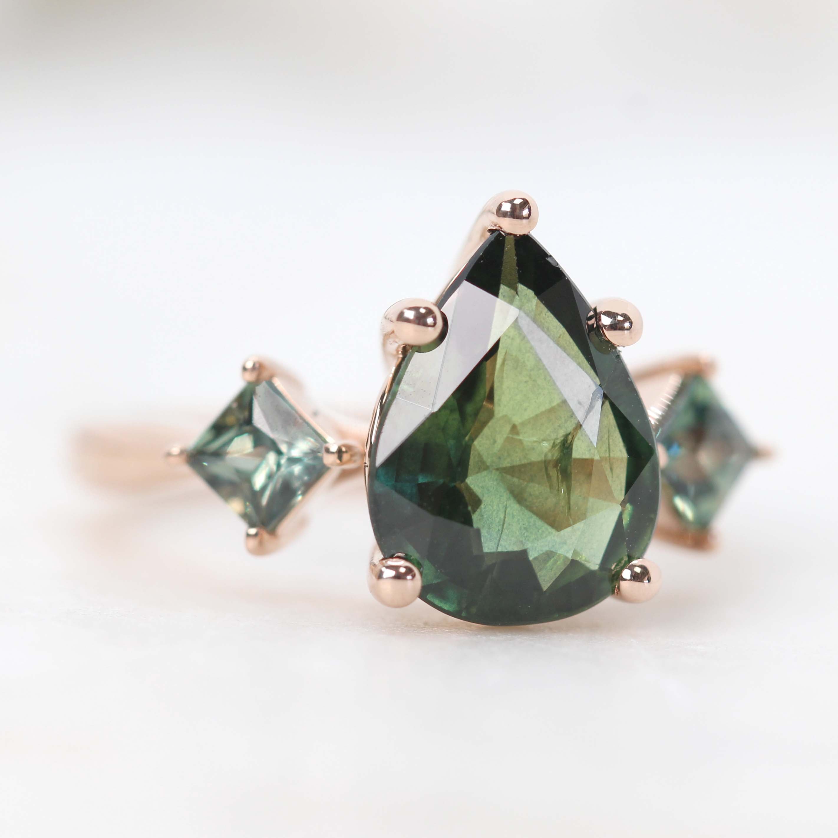 Angelique Ring with a 3.00 Carat Green Pear Sapphire and Blue Accent Sapphires in 14k Rose Gold - Ready to Size and Ship - Midwinter Co. Alternative Bridal Rings and Modern Fine Jewelry