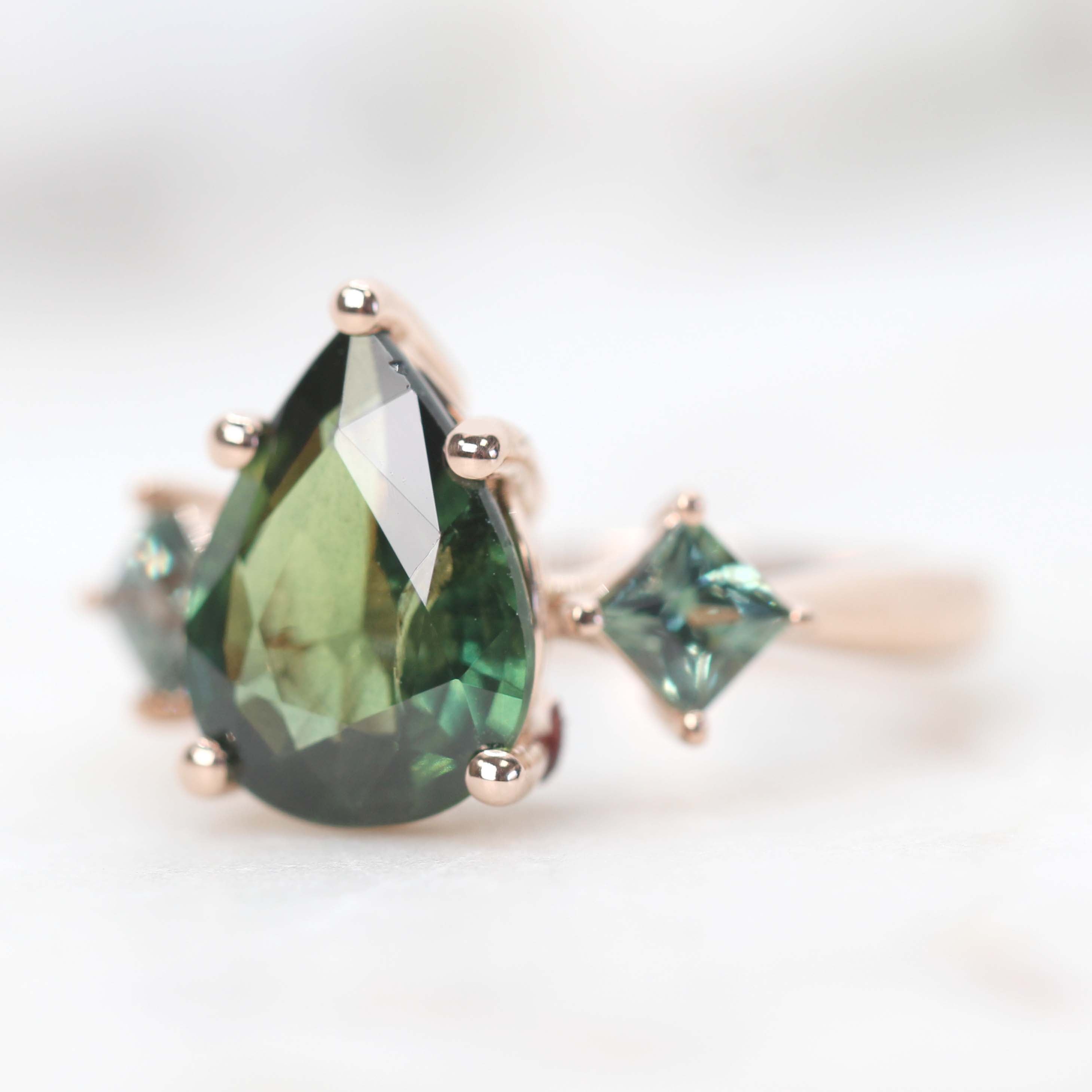 Angelique Ring with a 3.00 Carat Green Pear Sapphire and Blue Accent Sapphires in 14k Rose Gold - Ready to Size and Ship - Midwinter Co. Alternative Bridal Rings and Modern Fine Jewelry