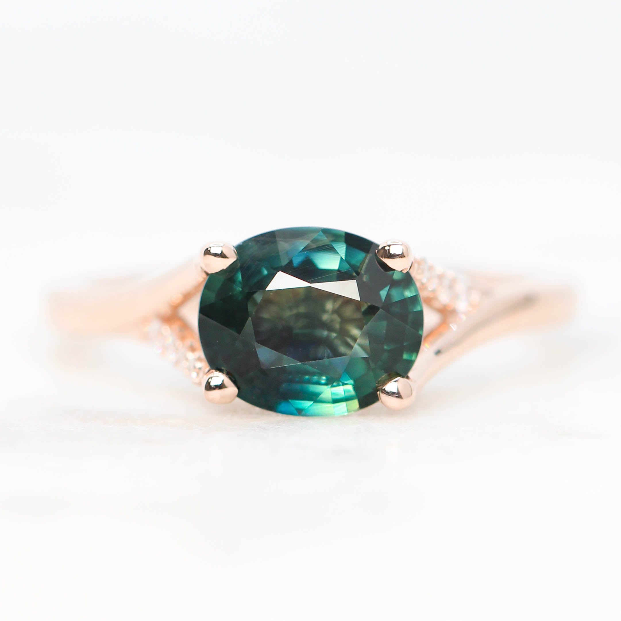 Kennedy Ring with a 2.12 Carat Oval Teal Sapphire and White Accent Diamonds in 14k Rose Gold - Ready to Size and Ship - Midwinter Co. Alternative Bridal Rings and Modern Fine Jewelry