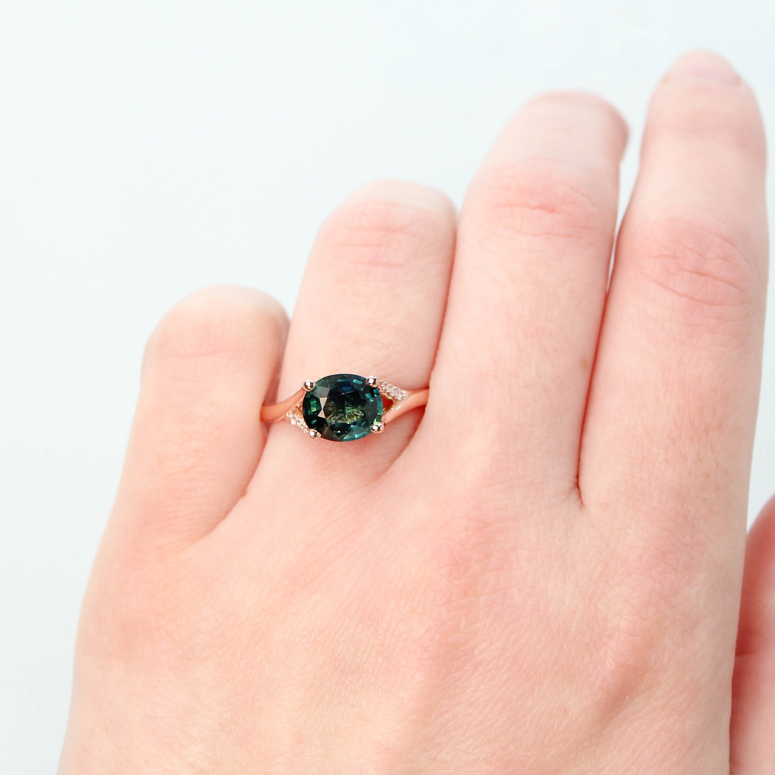 Kennedy Ring with a 2.12 Carat Oval Teal Sapphire and White Accent Diamonds in 14k Rose Gold - Ready to Size and Ship - Midwinter Co. Alternative Bridal Rings and Modern Fine Jewelry