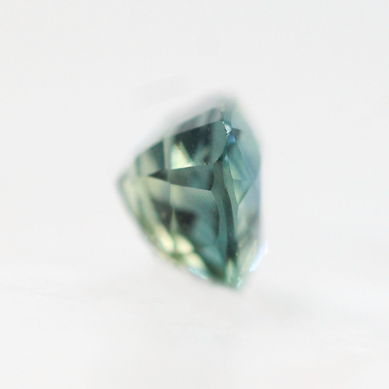 CAELEN (J) 1.13 Carat Blue-Green Trillion Cut Sapphire for Custom Work - Inventory Code BGTS113 - Midwinter Co. Alternative Bridal Rings and Modern Fine Jewelry