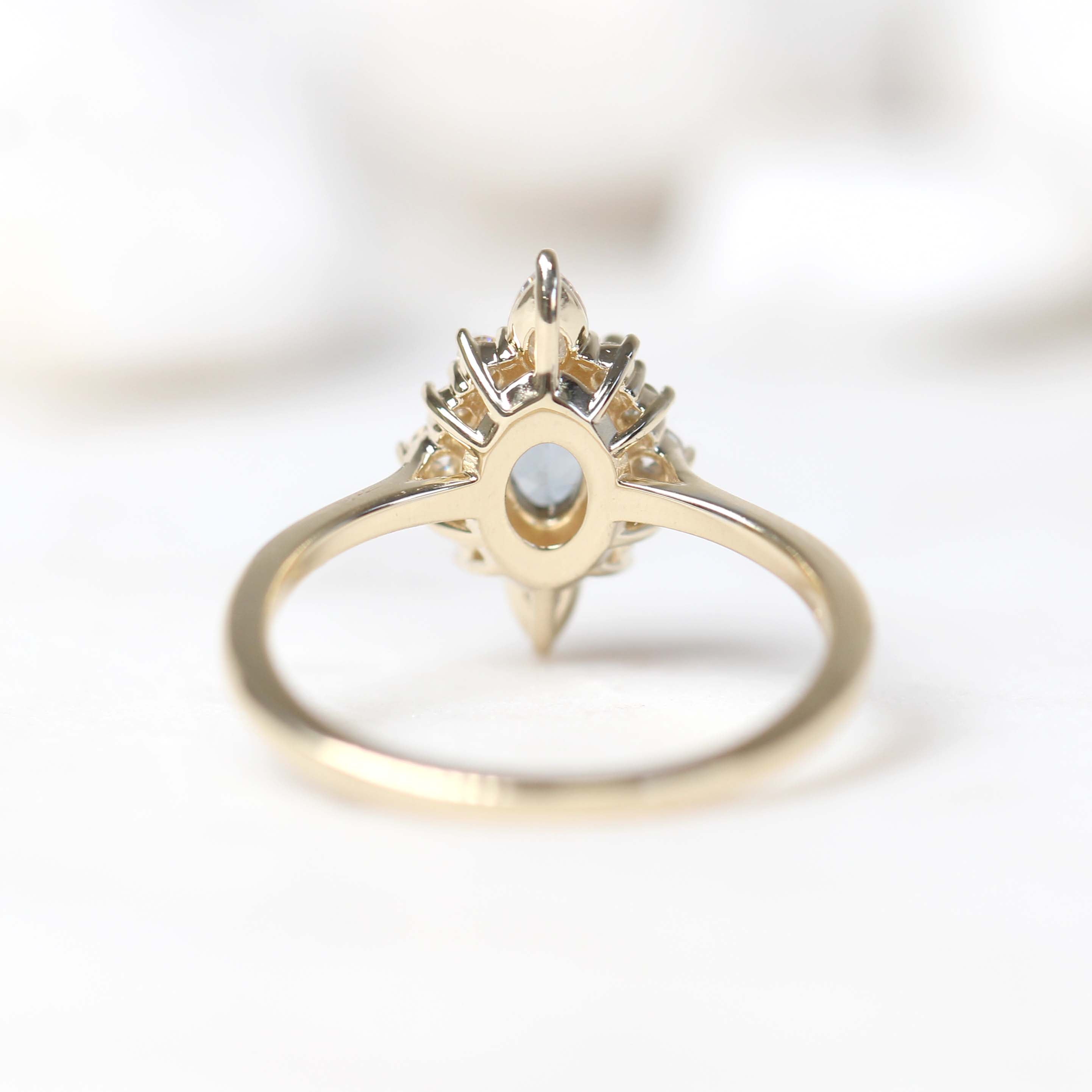 Noelle Ring with a 0.88 Carat Blue Gray Oval Spinel and White Accent Moissanites in 14k Yellow Gold - Ready to Size and Ship - Midwinter Co. Alternative Bridal Rings and Modern Fine Jewelry