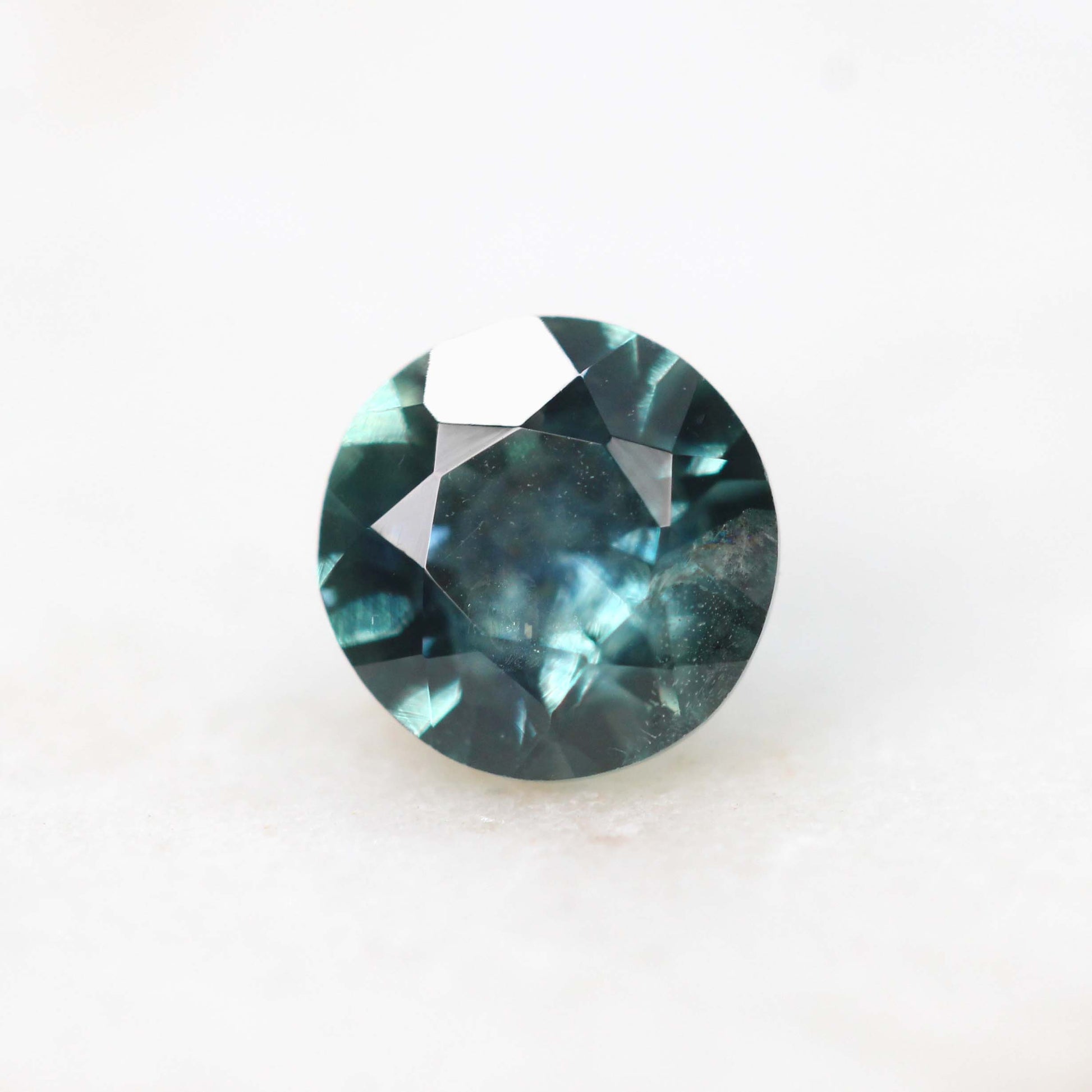 5mm Round Teal Montana Sapphire for Custom Work - Inventory Code TRMS057 - Midwinter Co. Alternative Bridal Rings and Modern Fine Jewelry