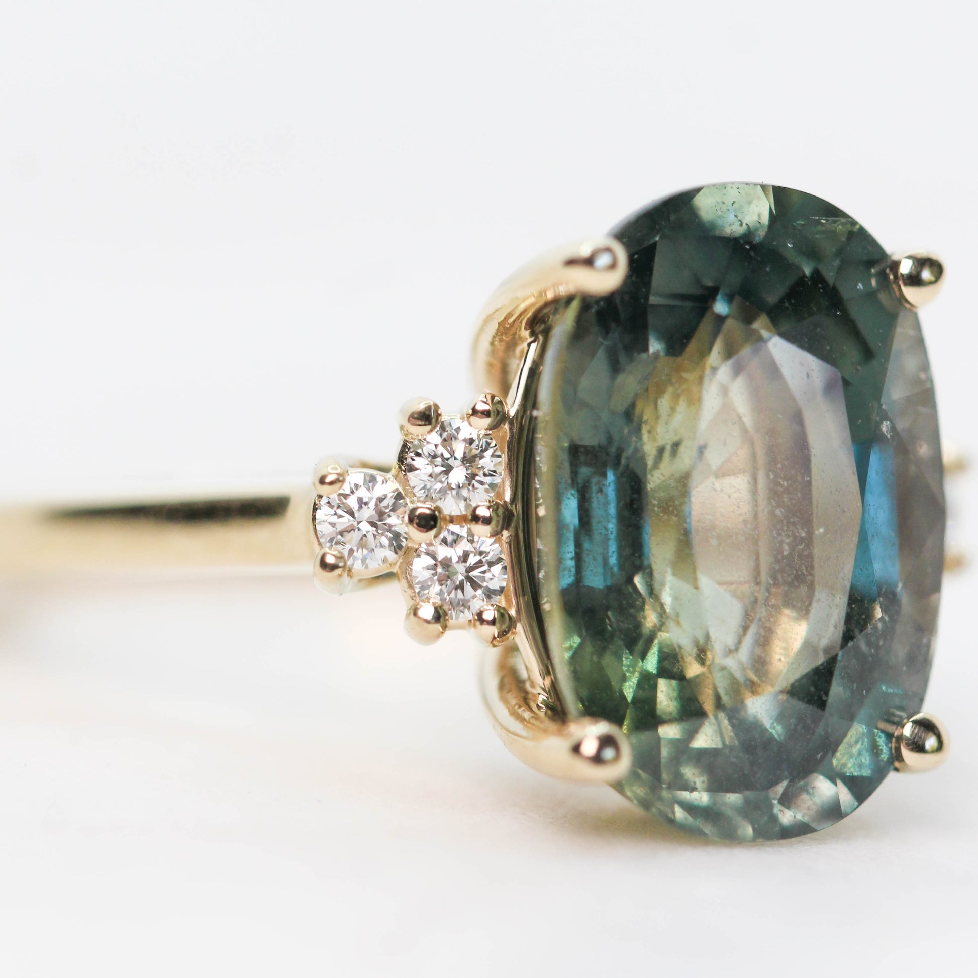 Veragene Ring with a 10.48 Carat Blue Green Oval Sapphire and White Accent Diamonds in 14k Yellow Gold - Ready to Size and Ship - Midwinter Co. Alternative Bridal Rings and Modern Fine Jewelry