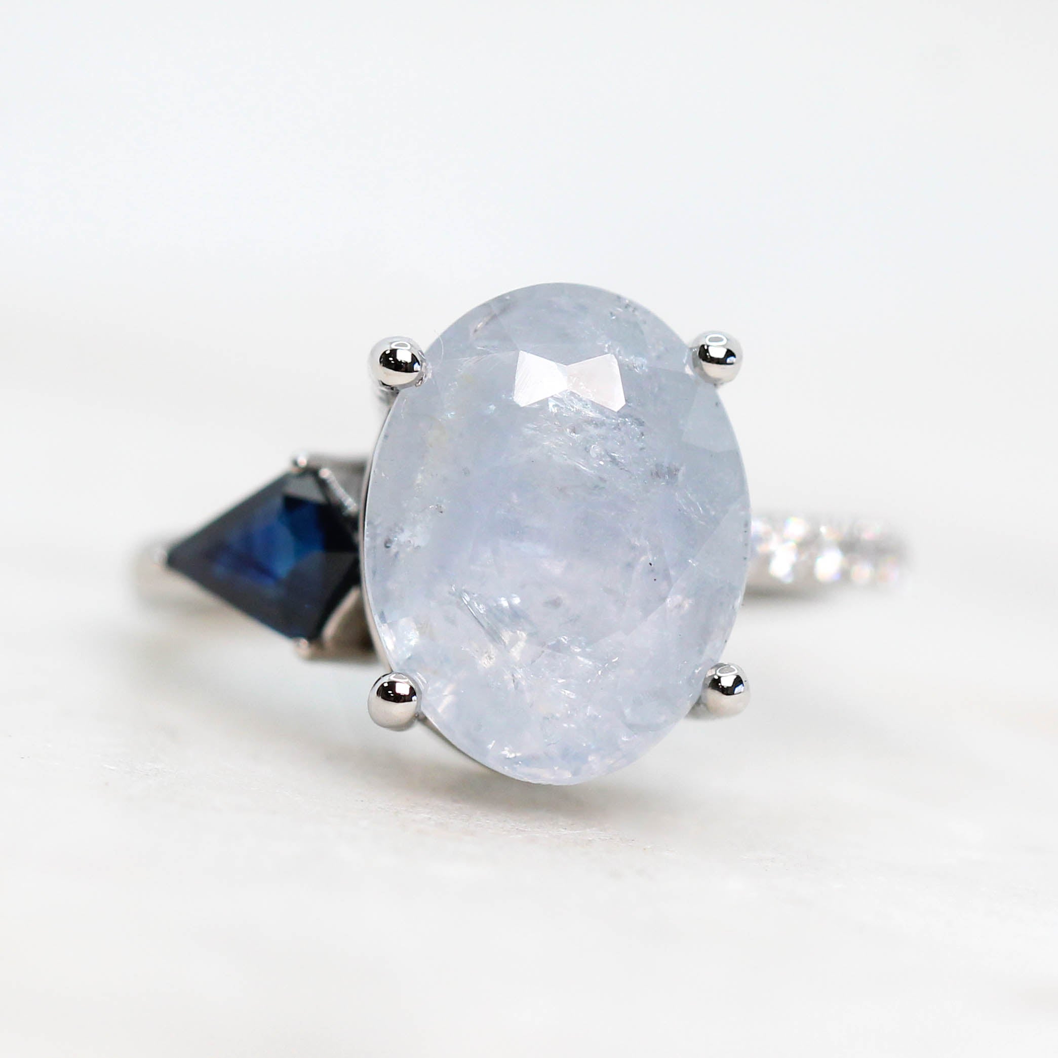 Zephyr Ring with a 6.62 Carat Light Blue Sapphire, Accent Sapphire and Accent Diamonds in 14k White Gold - Ready to Size and Ship - Midwinter Co. Alternative Bridal Rings and Modern Fine Jewelry