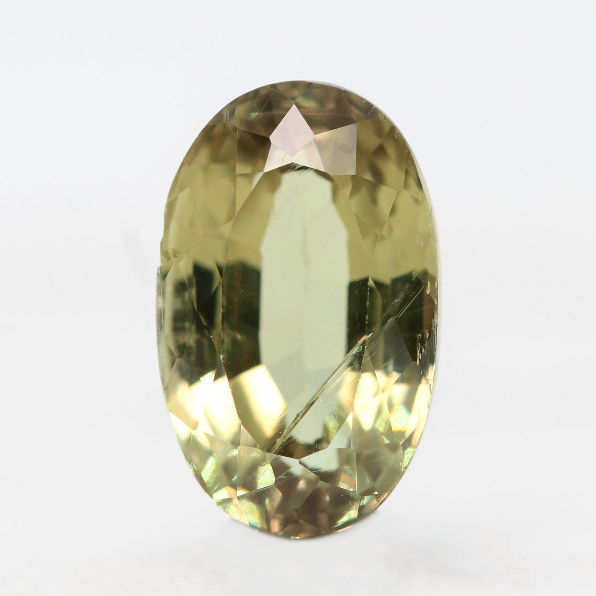 3.40 Carat Yellow-Green Oval Sapphire for Custom Work - Inventory Code YGOS340 - Midwinter Co. Alternative Bridal Rings and Modern Fine Jewelry