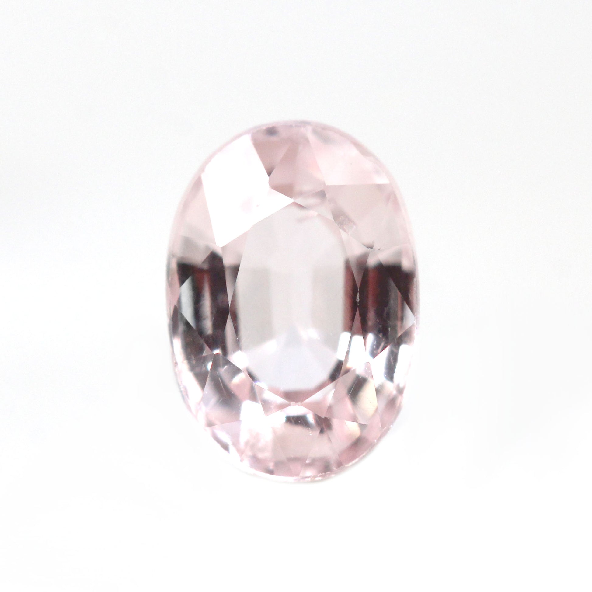 0.77 Carat Clear Light Pink Oval Montana Sapphire for Custom Work - Inventory Code PSO077 - Midwinter Co. Alternative Bridal Rings and Modern Fine Jewelry