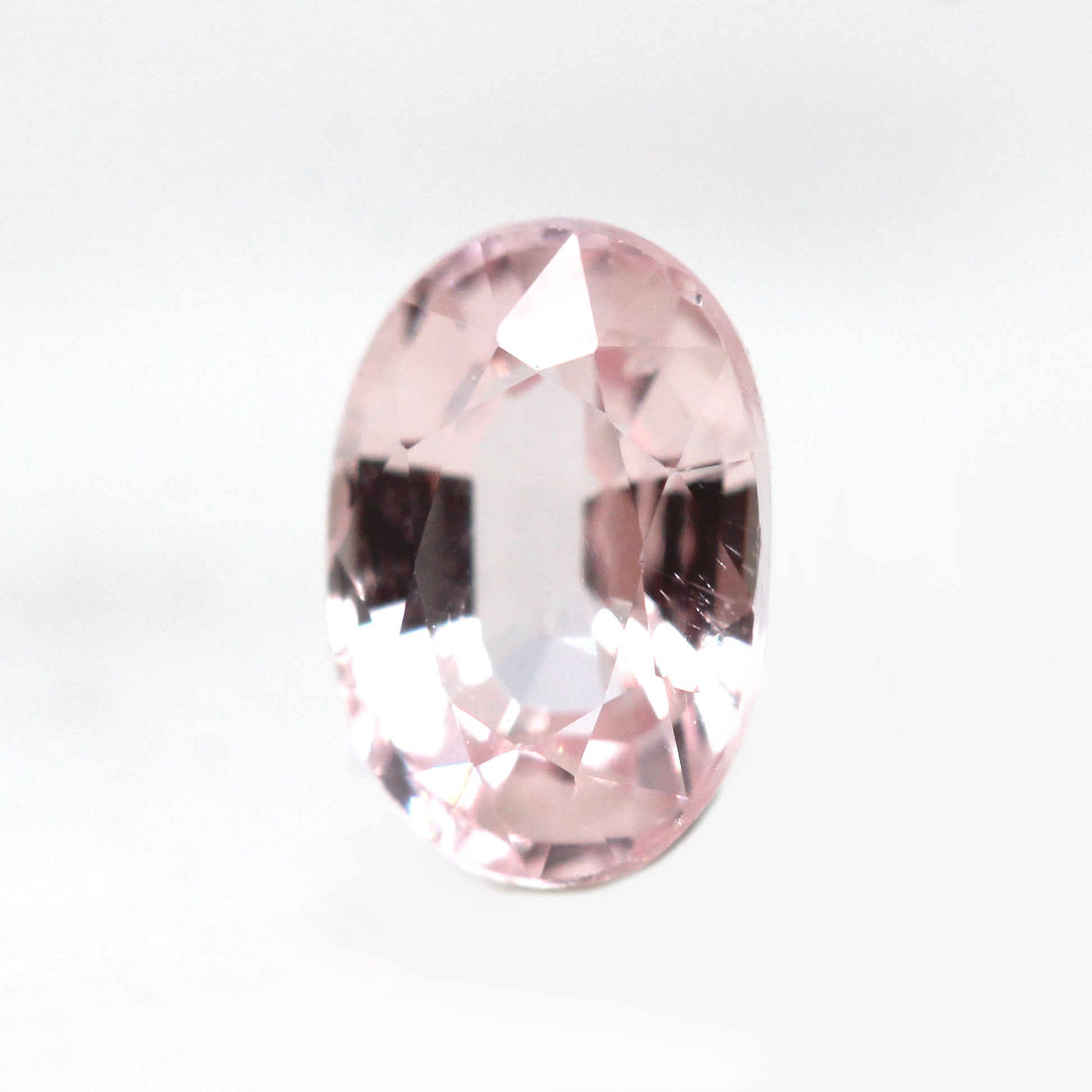 0.77 Carat Clear Light Pink Oval Montana Sapphire for Custom Work - Inventory Code PSO077 - Midwinter Co. Alternative Bridal Rings and Modern Fine Jewelry