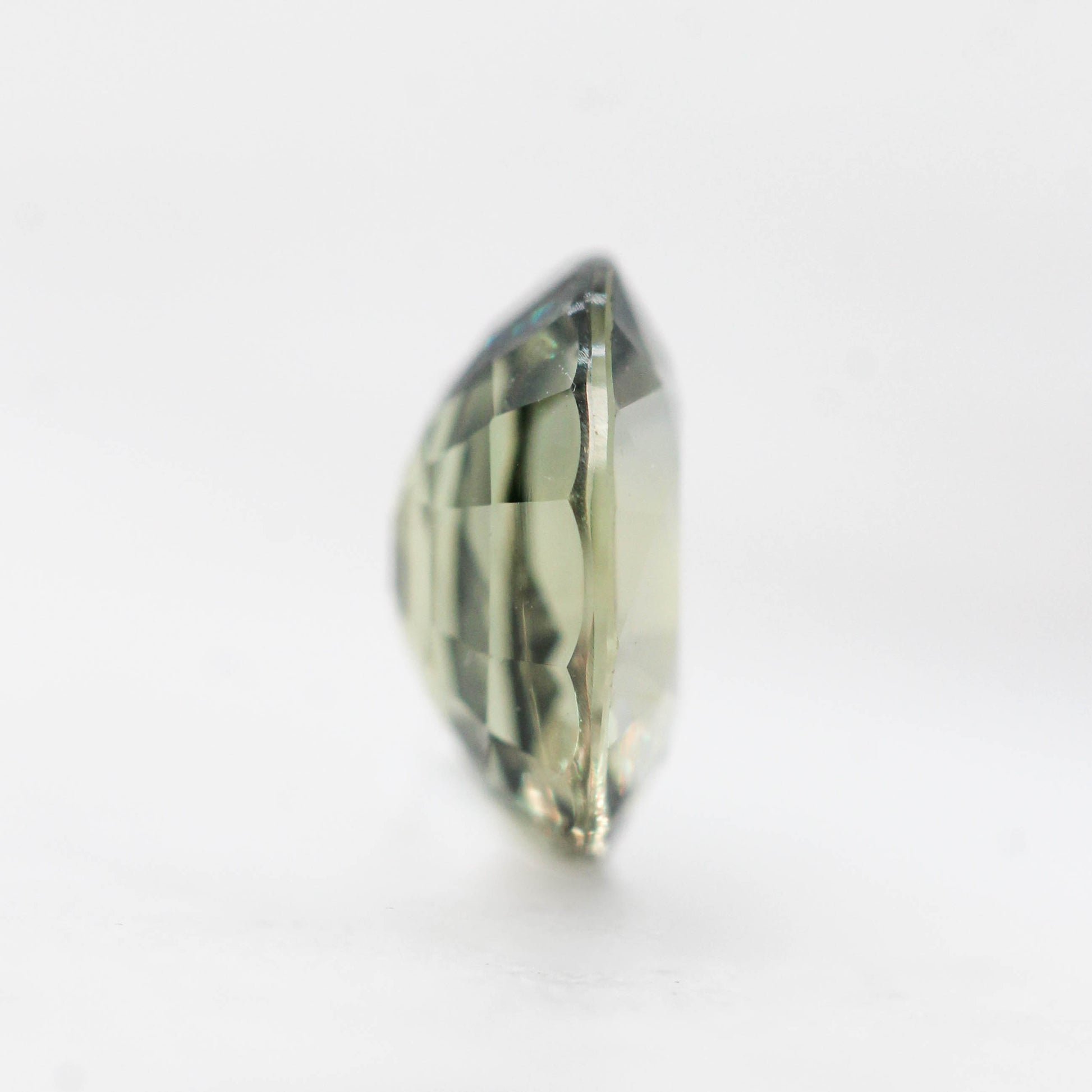 1.16 Carat Olive Green Oval Sapphire for Custom Work - Inventory Code OOS116 - Midwinter Co. Alternative Bridal Rings and Modern Fine Jewelry