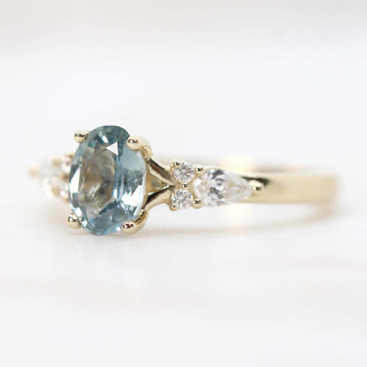 Jenna Ring with a 0.93 Carat Light Blue Oval Sapphire and White Accent Diamonds in 14k Yellow Gold - Ready to Size and Ship - Midwinter Co. Alternative Bridal Rings and Modern Fine Jewelry